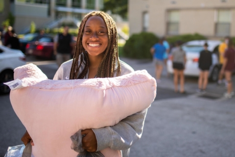 female student smiling during move-in day