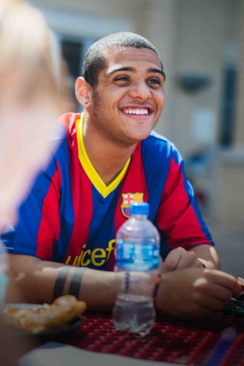 Smiling student sitting outside