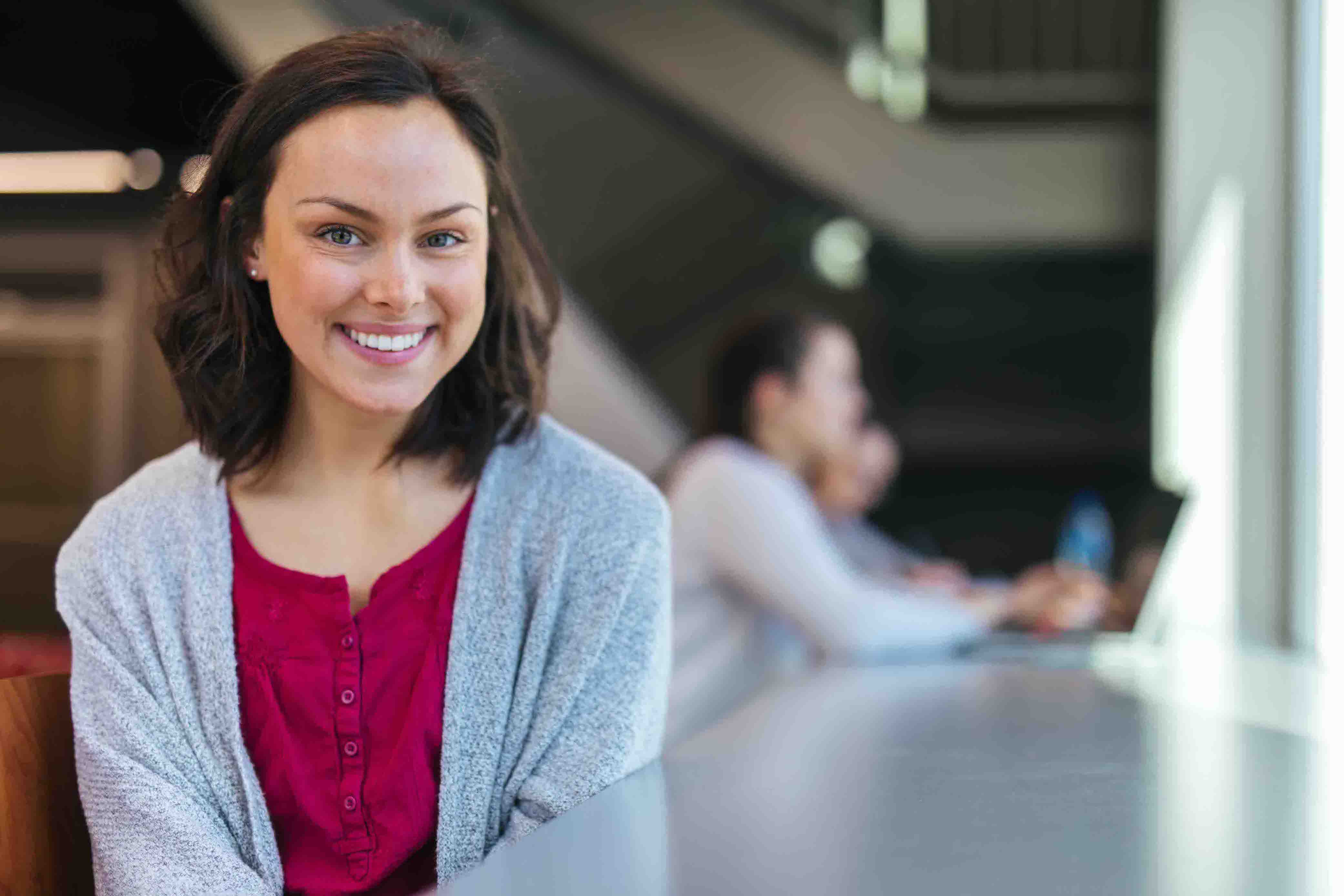 female student smiling at camera