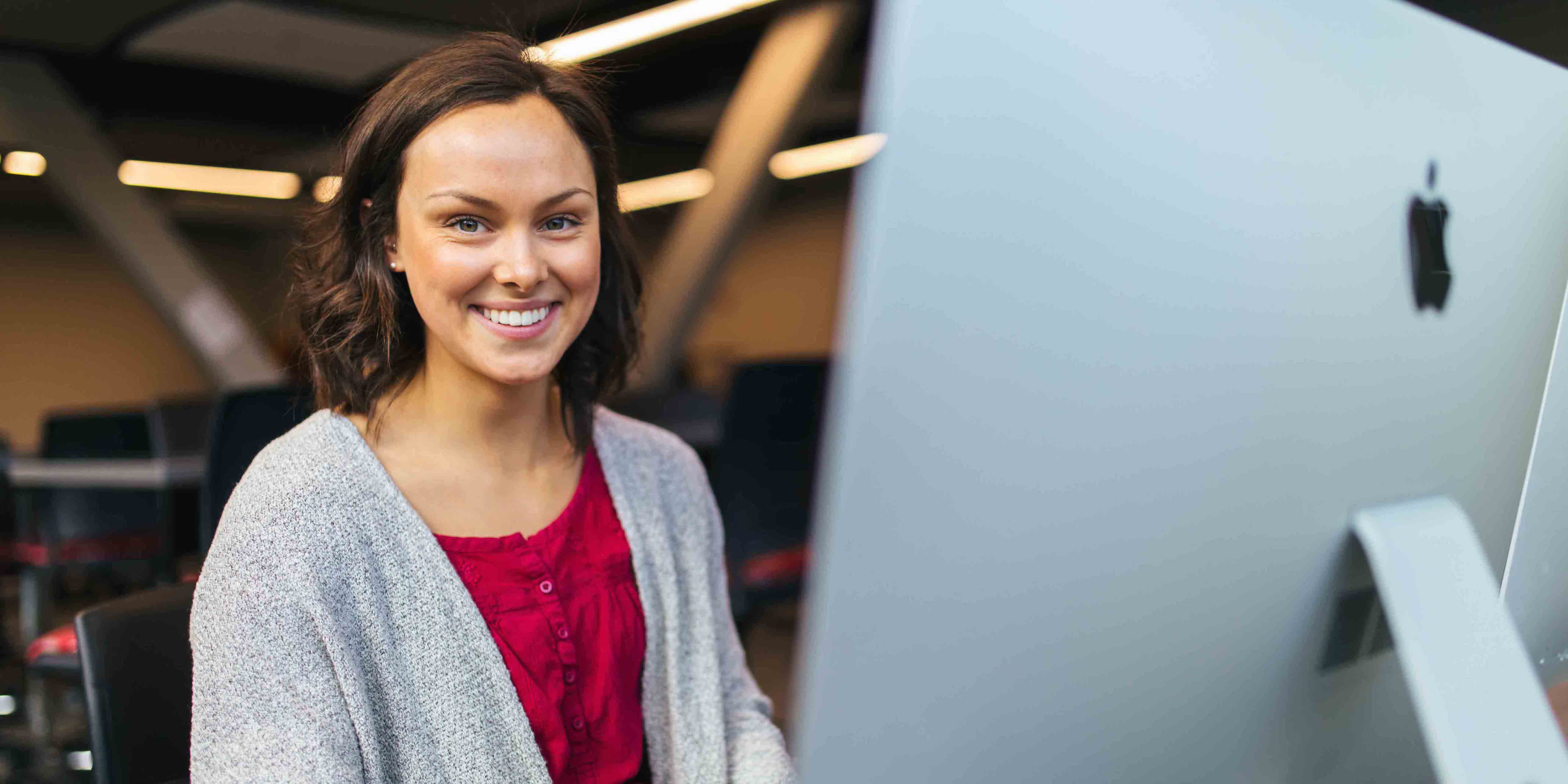 female student smiling at camera