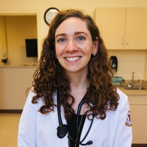 Physician assistant student posing in simulation lab