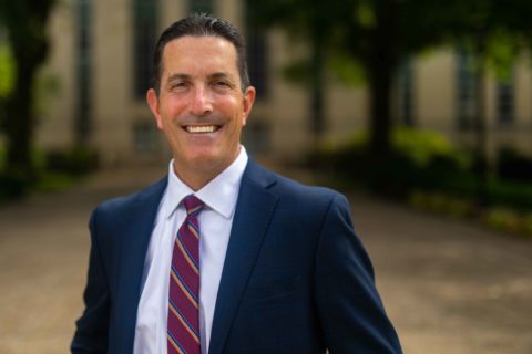 close up of President Roth in suit