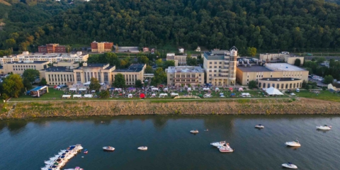 drone view of symphony sunday event on the riverbank lawn