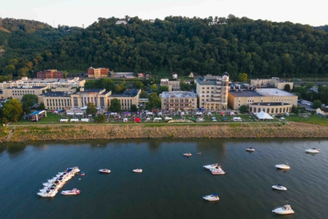 drone view of symphony sunday event on the riverbank lawn