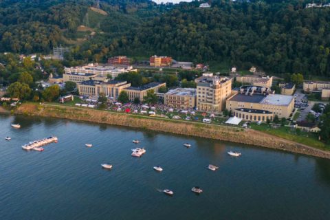 drone shot of Symphony Sunday on the riverbank lawn