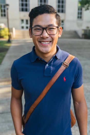 close up of smiling male student outside of Riggleman Hall