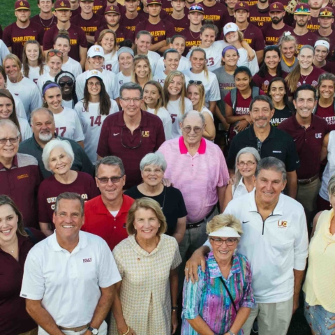 Group posing for drone shot at the Welch Athletic Complex Grand Opening