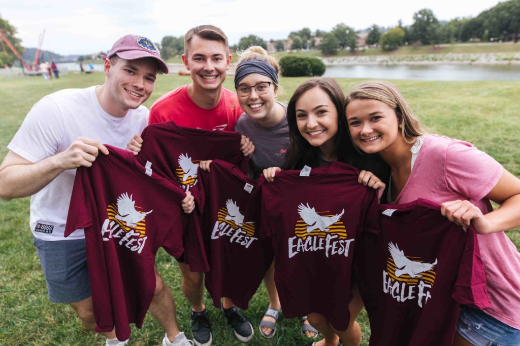 group of students posing with EagleFest t-shirts