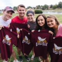 group of students posing with EagleFest t-shirts