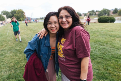 Student posing with International Director staff member