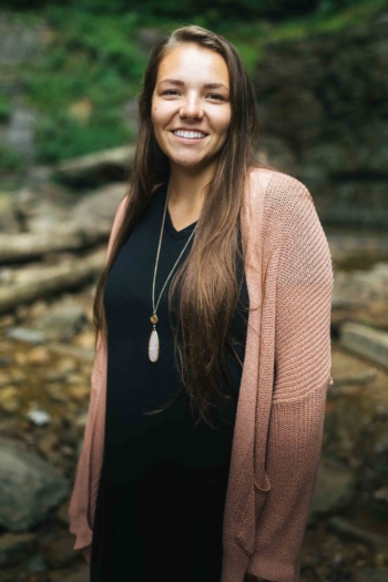 Smiling female standing outside