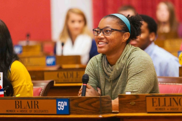 group of students sitting in WV House of Delegates seats in House of Delegates Chamber