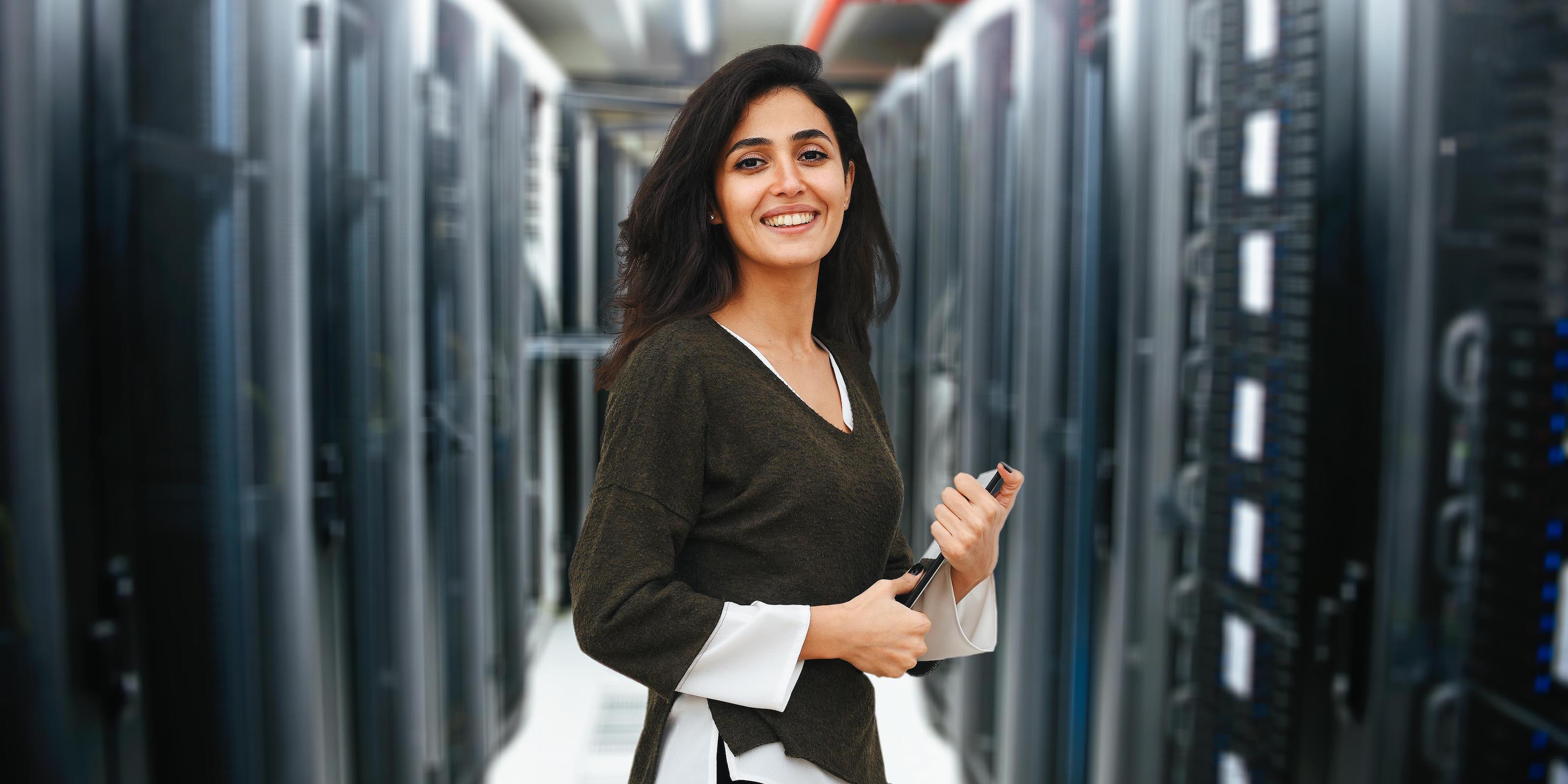 female IT professional in data center